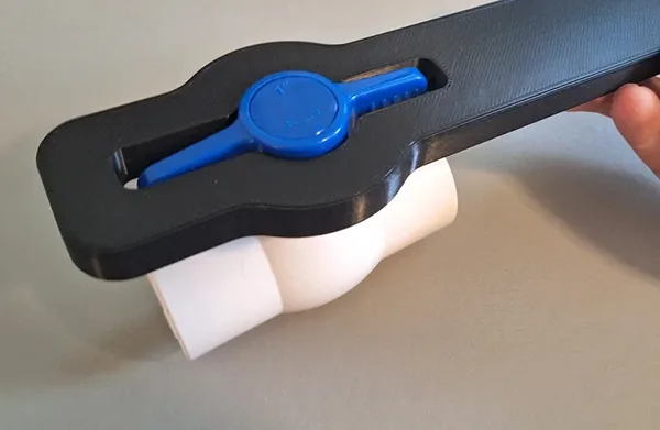 Using Pliers to Turn a PVC Valve A person correctly using channel-lock pliers on a PVC valve handle