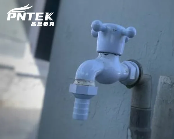 Common Bib Tap Installation Location A bib tap conveniently installed on the exterior brick wall of a home