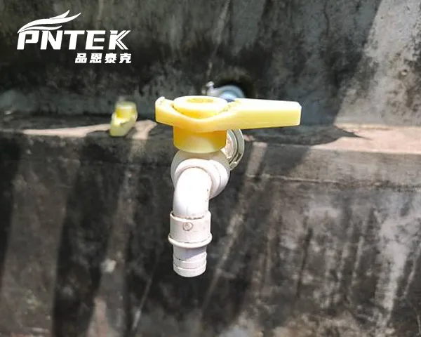 Difference Between Bib Tap and Normal Tap A rugged bib tap placed next to a sleek kitchen tap for comparison