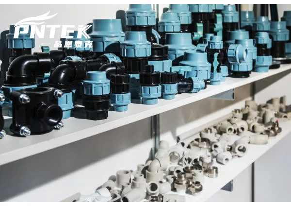 Raw Polypropylene Material for Piping A collection of raw PP pellets next to a finished Pntek fitting