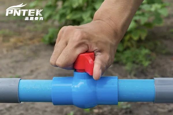 Inspecting PVC Ball Valves for Replacement A maintenance worker inspecting a row of PVC ball valves with a checklist